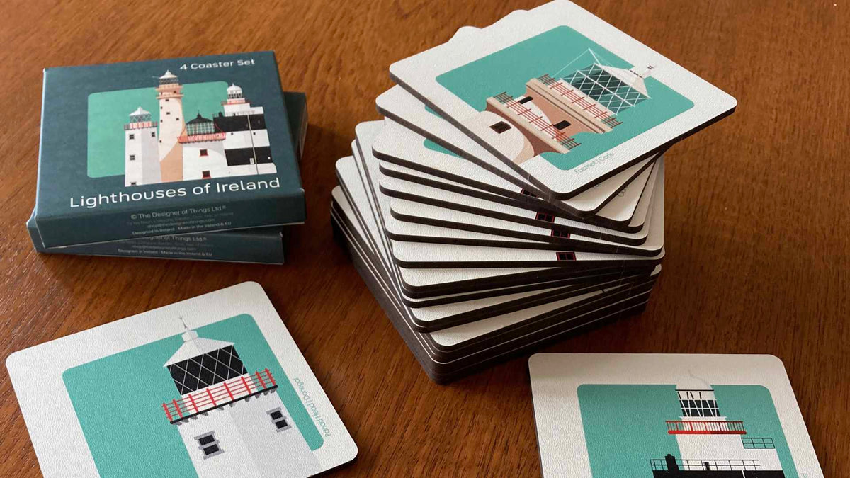 Lighthouses of Ireland coaster set on a teak mid century table