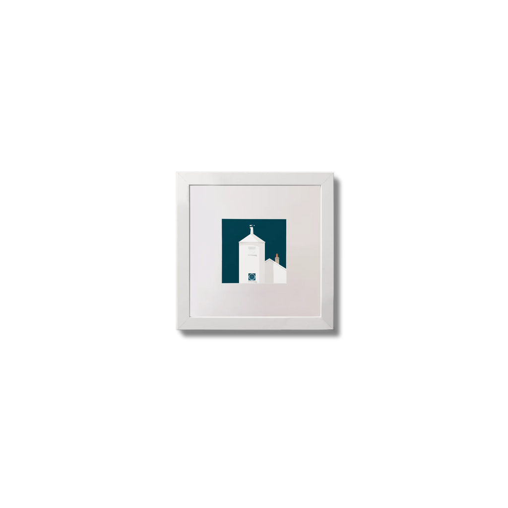 Small framed artwork of a white lighthouse with small building next to it on a midnight blue background