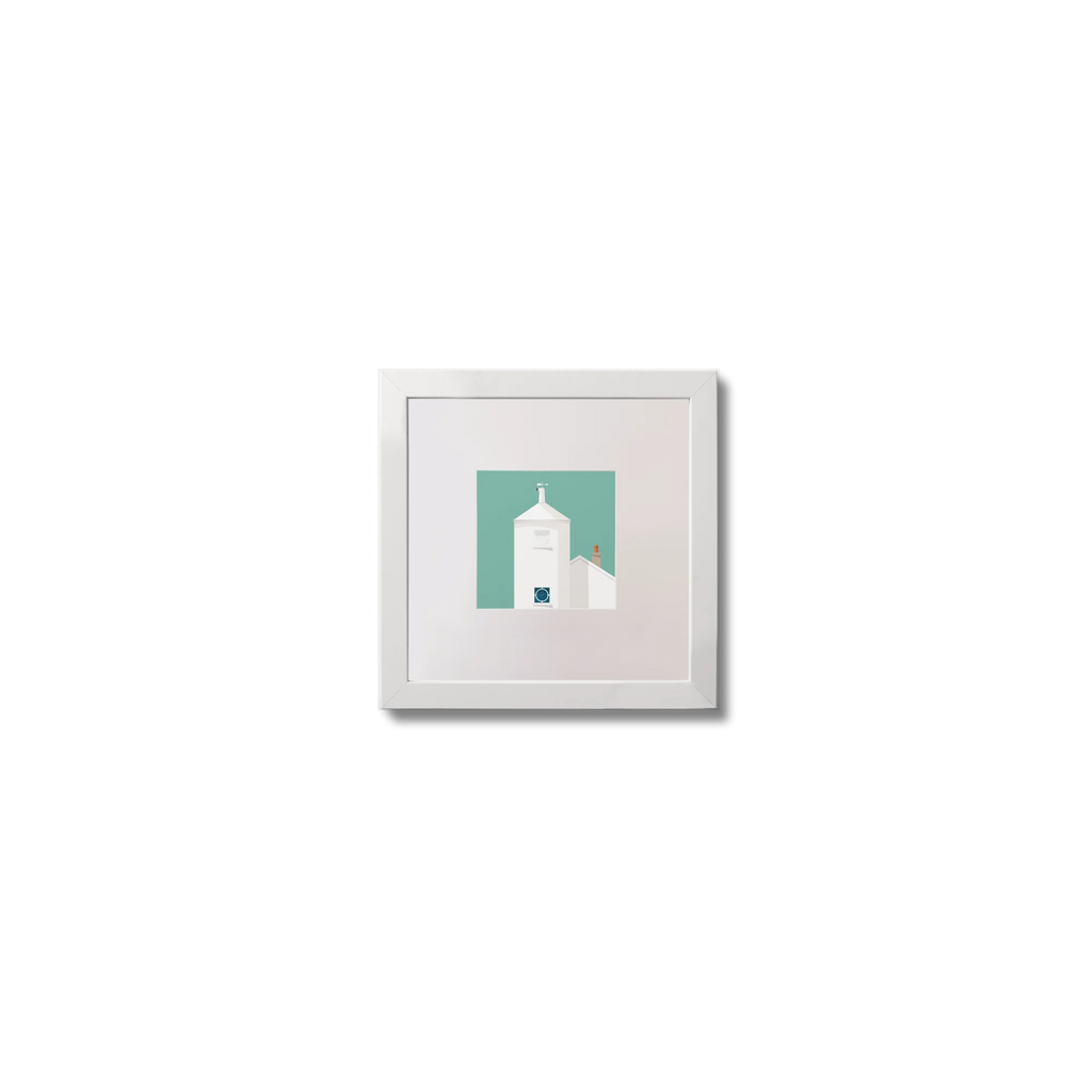 Small framed artwork of a white lighthouse with small building next to it on an ocean green background