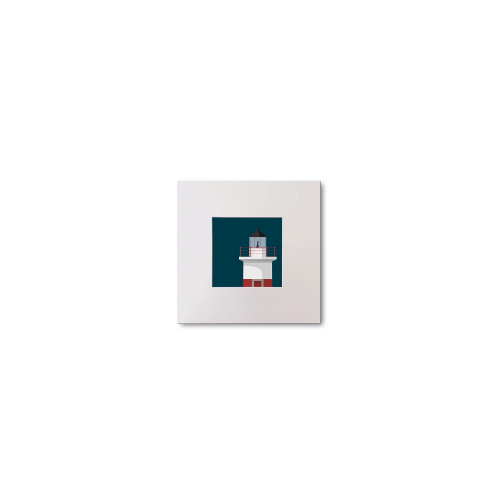 Framed artwork of a lighthouse on a blue background