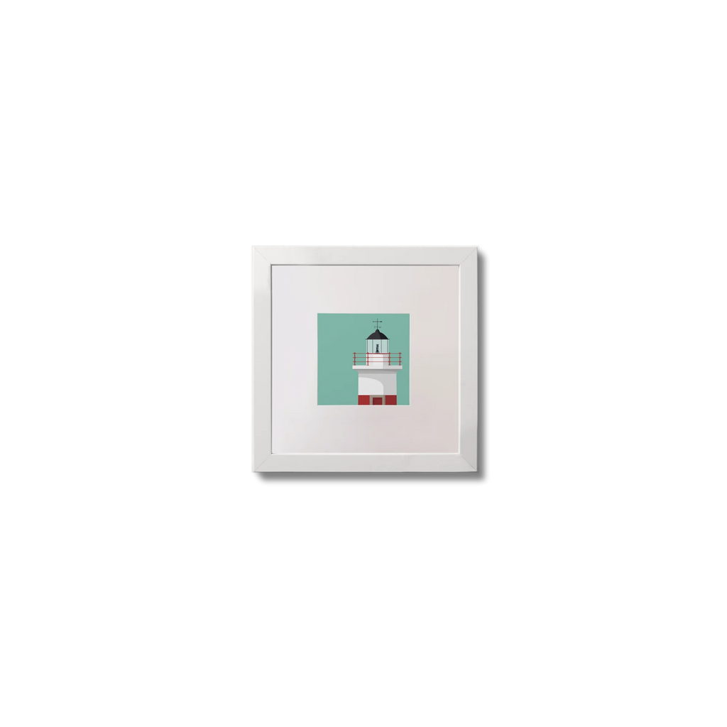 Framed artwork of a lighthouse on a ocean green background