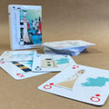 Playing cards with Lighthouses of Ireland design on a brown surface