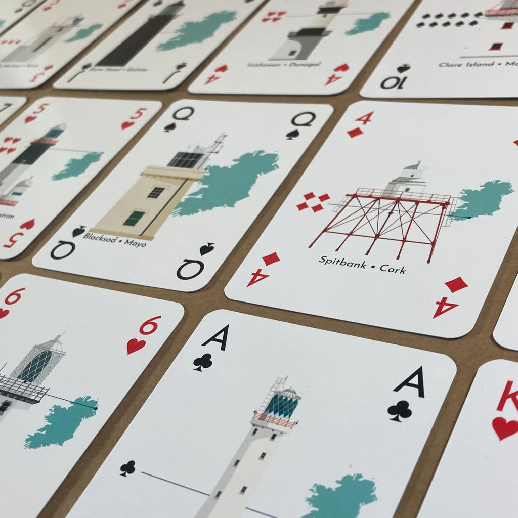 Lighthouses of Ireland playing cards with  illustrations on a table