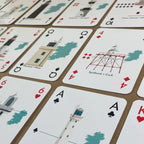 Lighthouses of Ireland playing cards with  illustrations on a table