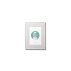 Contemporary wall hanging of Dunree lighthouse on a white background inside light blue square,  in a white frame measuring 15x20cm.