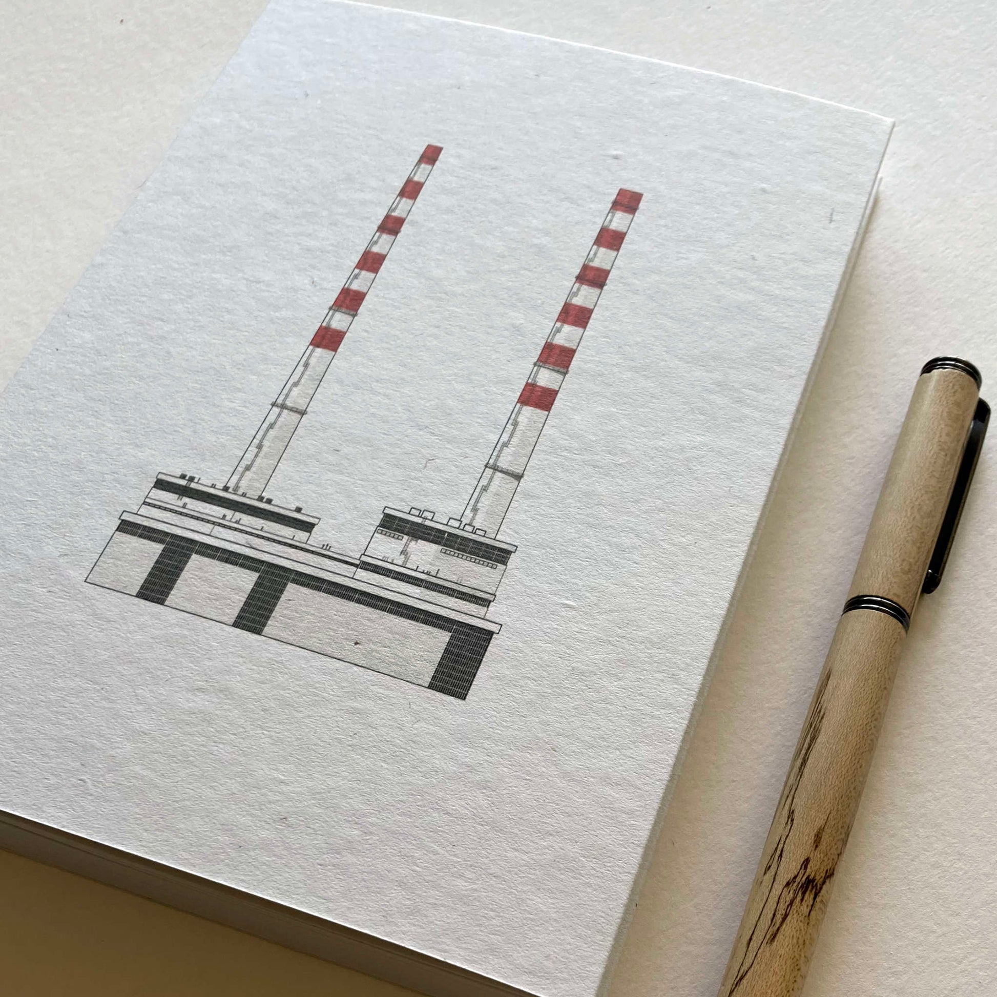 A5 sized notebook with Poolbeg Chimneys Dublin printed on the cover with custom walnut pen.