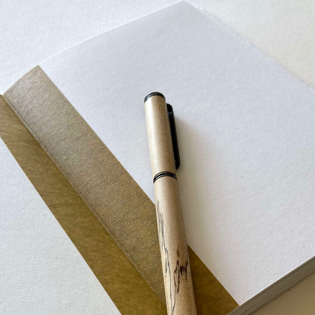 122 blank pages A5 sized notebook made from recycled cartridge paper.